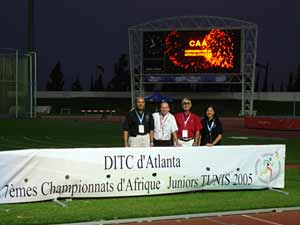 team in front of banner