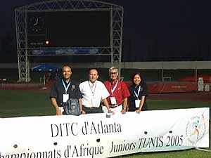 team in front of banner